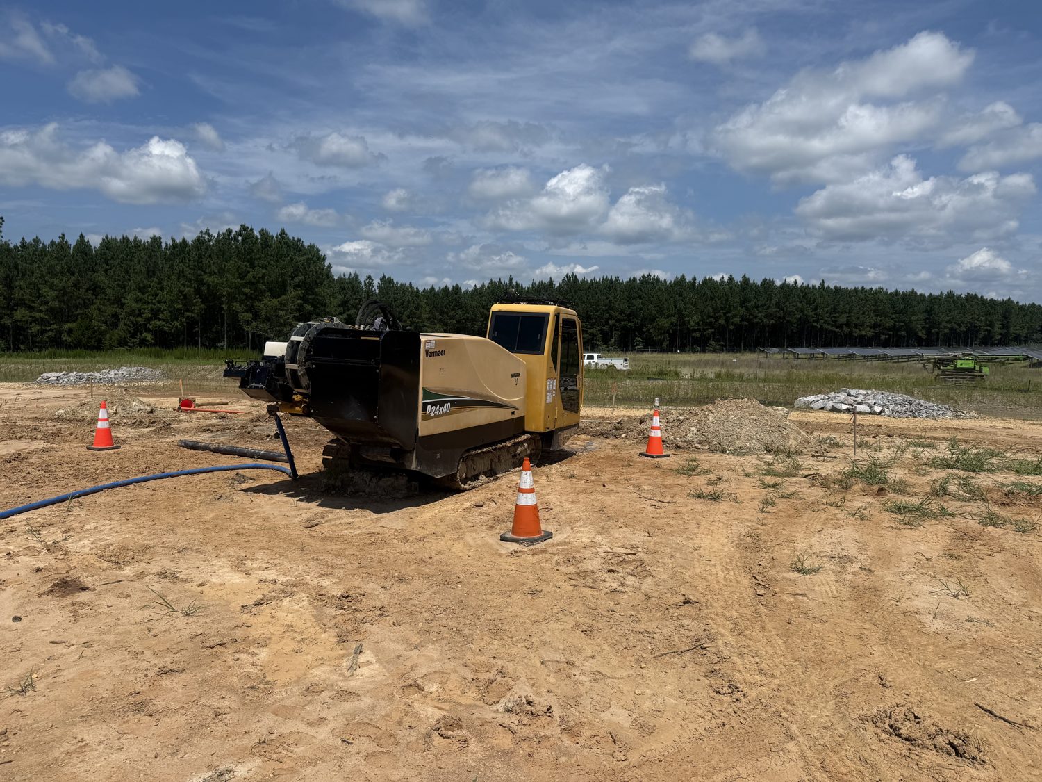 Conduit and conductor staged at a directional drilling exit pit