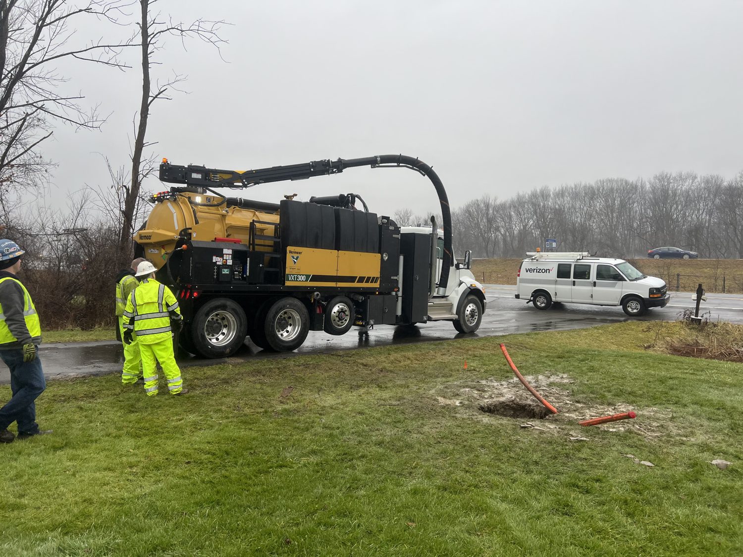 Vacuum-excavation truck potholing to daylight existing utilities